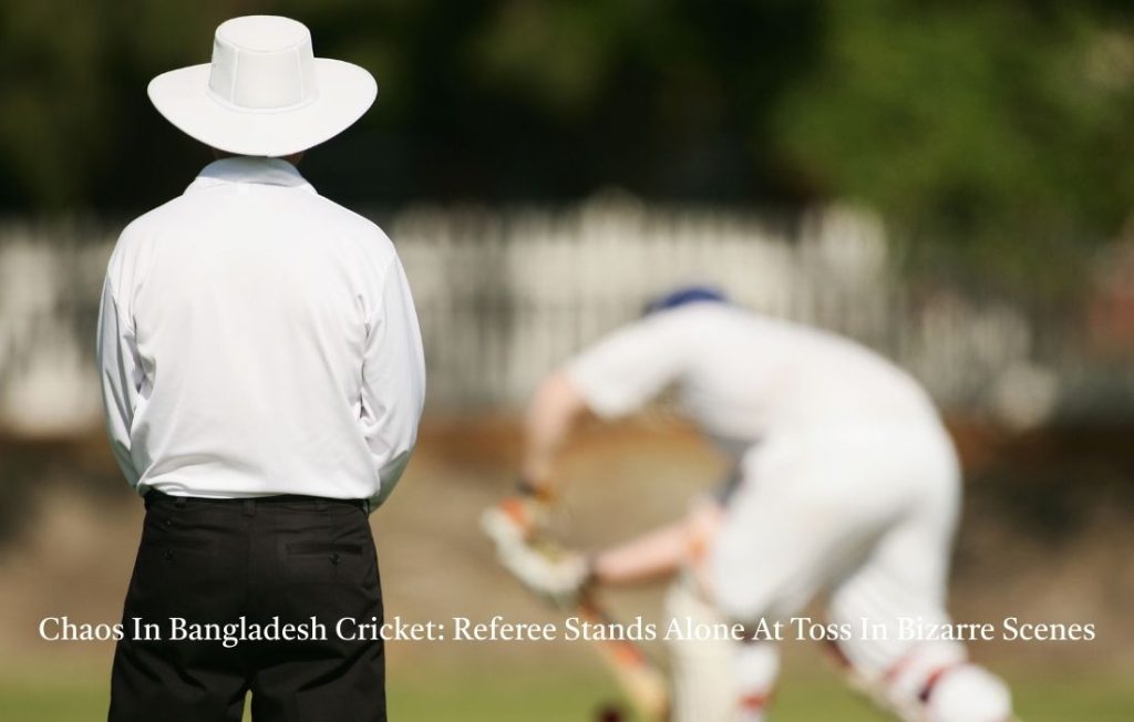 referee stands alone at toss